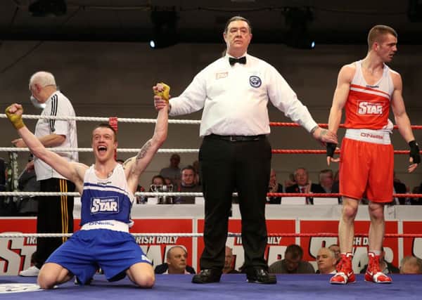 Steven Donnelly sinks to his knees after being given the verdict in his Irish National Elite Championship welterweight final against reigning champion Adam Nolan. Picture: INPHO.