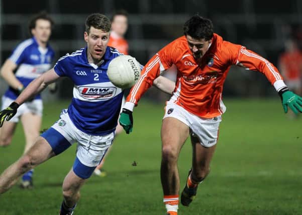 Armagh's Stephen Campbell with Laois' Denis Booth.