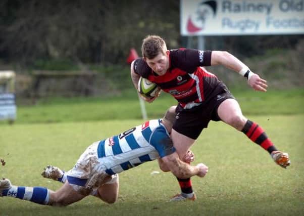 TACKLE... Dungannon break down this Rainey attack during Saturday's Ulster League clash at Hatrick Park.INMM1114-369SR
