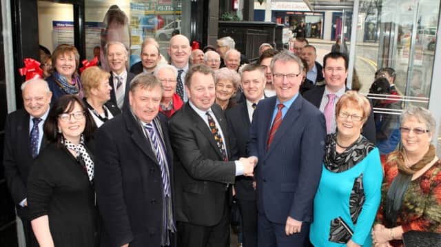 Mike Nesbitt MLA, leader of the Ulster Unionist Party, with Danny Kinahan MLA and party members and supporters outside the new South Antrim constituency office in Ballyclare. INNT 11-041-FP
