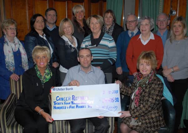 Cancer Research UK Fundraising Manager Mark McMahon is pictured receiving a £34,905.30 cheque from Eileen Moore (Chairperson) and Dorothy McKeown (Treasurer) of Ballymena Branch of Cancer Research UK, proceeds from their yearly collection.