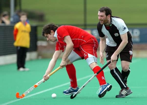 BATTLE... Cookstown's Mark Crooks battles for the ball during Satuardy's IHL clash with Cork Harlequins at Steelweld Park.INMM1114-374SR
