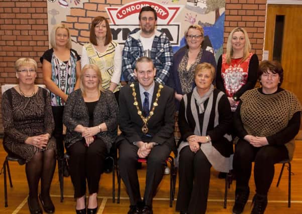 The Mayor Of Derry Cllr Martin Reilly pictured at the YMCA Drumahoe, during the Health & Wellbeing Through The Arts Project, funded by the P.H.A, with seated from left, Hilary McClintock (Drumahoe Community Ressidents), Linda Watson (Caw & Nelson Drive Action Group), Hilary Parke (Public Health Agency) & Niree McMorris (Irish Street Ressidents Group). Standing from left, Betty O'Reilly (Clooney Estate), Alison Wallace (Waterside Neighbour Partnership), Gareth Lamrock (YMCA), Julie Kee (Tullyalley Ressidents Group) & Karen Mulan (Hillcrest House). (DJ-0703-GMI-10)