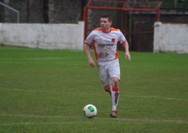 Carrick defender Ciaran Donaghy.