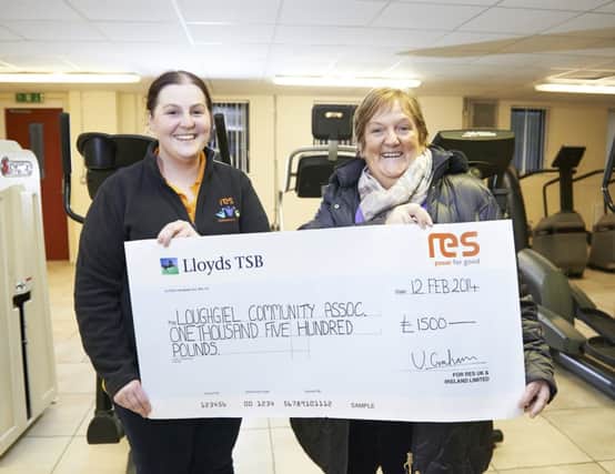 Victoria Graham, Community Relations Manager, RES presents Angela OHagan from Loughgiel Community Association with a cheque for £1500. inbm12-14