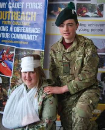 Cadet L/Cpl Cameron Waring from Ballymena Detachment who successfully completed a First Aid at Work Course with his practice casualty Kim Magee.