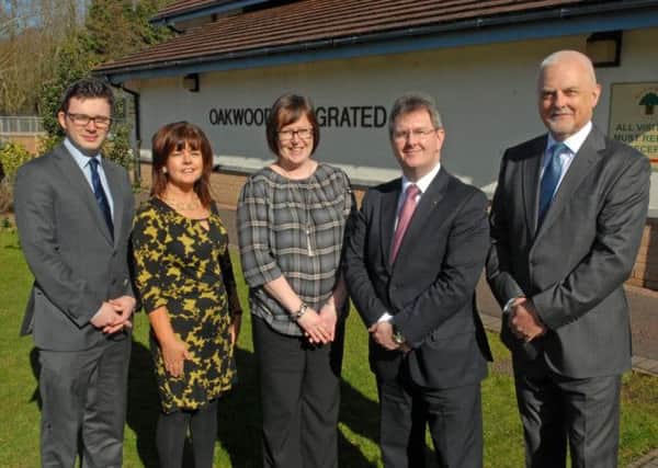 Celebrating success at Oakwood Integrated Primary School are Matthew McDermott, chair of the Board of Governors, Mrs Loretta Joyce, Childrens Centre manager, Mrs Claire Howe, principal, Jeffrey Donaldson, MP, and Tom Wright, Board of Governors. INUS1114-OAKWOOD