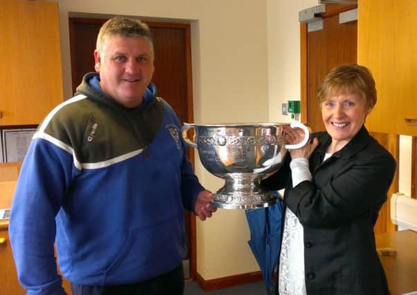 St.Patrick's College teacher Dermot McNicholl and Principal Anne Scott are pictured with the MacRory Cup before it departs the school for the Athletic Grounds in Armagh. Will it make the return journey on Monday?