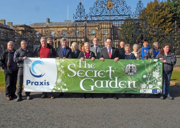 Supporters of the Praxis Secret Gardeb who gathered at the gates of Hillsborough Castle. INUS1214-PRAXIS