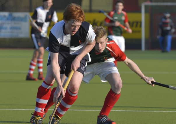 Mandatory Credit: ROWLAND WHITE / PRESSEYE
Hockey: Burney Cup Semi-Final
Teams: Wallace HS (blue/white) v Friends (green/red)
Venue: Lisnagarvey
Date: 12th March 2014
Caption: Ryan Getty, Wallace and Ryan Donaldson, Friends