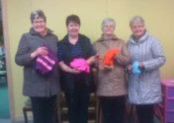 Doreen Armstong from the Ballymena Salvation Army Charity Shop, pictured with Knitting Group Members, Renee, Florence and Elsie  INBT-11F-DOREEN ARMSTRONG