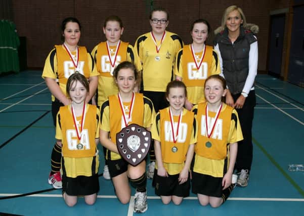 The Buick Memorial PS team who were winners of the Ballymena and District Primary Schools Netball League pictured with coach Mrs. C. Hunter. INBT10-211AC