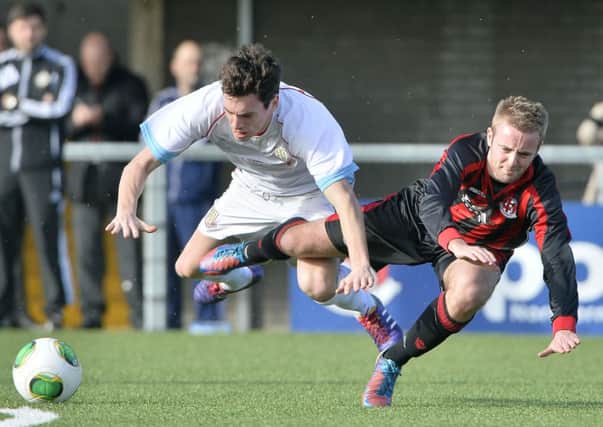 Ballymena United's Mark Surgenor tangles with Crusaders' Richard Clarke during today's game at Seaview. Picture: Press Eye.