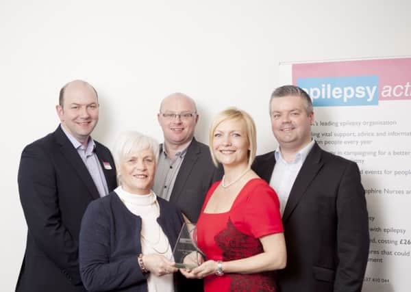 Vera McCready from Londonderry, who has been recognised for her voluntary work for Epilepsy Action.
From left to right: Andrew Frankish (son-in-law), Vera McCready (award winner), Gareth Johnson (son-in-law), Verona Frankish (daughter) and Peter McCready (son).