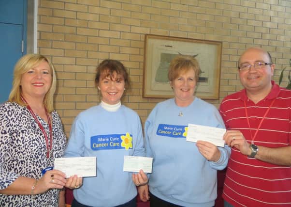 Martina Gibson and David Gallagher of the Civil Service Pensions  Department in Londonderry presenting a cheque to Fiona Wallace and Rhona Gallagher of City Friends of Marie Curie. 
The cheque was presented in memory of the late Tommy Semple who worked in the Civil Service Pensions Department. 
The money was raised through various fund raising activities.