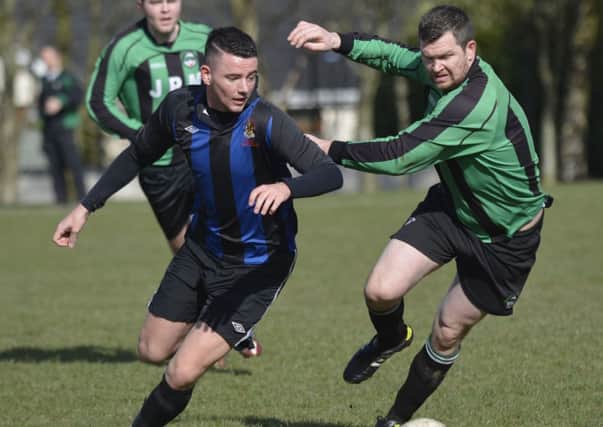 Joe McCready, BBOB, and Brian McLaughlin, Dungiven Reserves, tussle for the ball at Lisnagelvin on Saturday. INLS1114-134KM