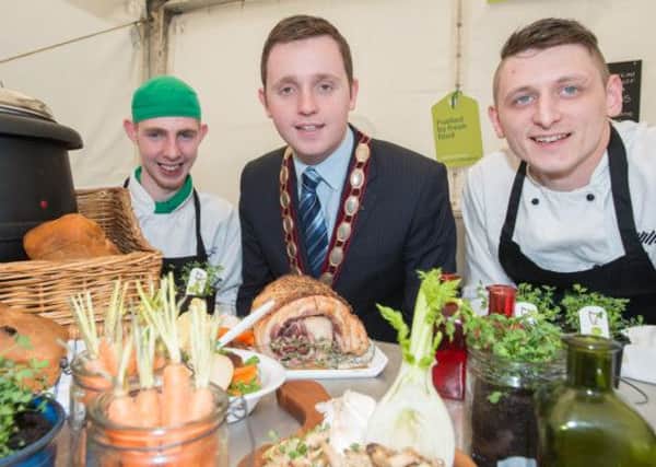Deputy Mayor Alderman Gary Middleton pictured Chefs Kyle McClelland and Neil McElwee during the Legenderry Food Festival in Guildhall Square. PIcture Martin McKeown. Inpresspics.com. 15.03.14