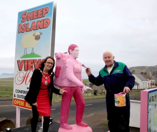 Moyle District Council Chairperson, Cllr  Cara McShane, pictured with her father, Seamus, at the Sheep Island hostel in Ballintoy, where Seamus has painted his Harry Ferguson tractor pink and the back packer has gone pink as well.... has said that preparations are well underway across the North Coast in preparation for the Giro dâ¬"Italia cycling race. PICTURE KEVIN MCAULEY PHOTOGRAPHY MULTIMEDIA