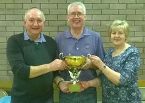 Maurice Britton with Ivor and Susan Moore, who were the winners of the 2014 Minnie Huey Memorial Cup Pairs tournament.