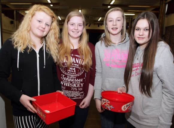 PAY HERE. Pupils from Ballymoney High, Jamiee-Leigh, Melissa, Cathie and Rachel, who were collecting donations from fellow pupils during an non-uniform day plus other events to raise funds for the 'Help Oliver Walk' campaign on Friday.INBM12-14 003SC.