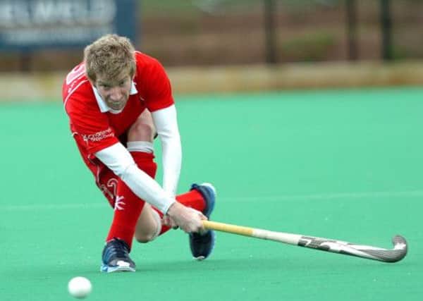 CROSS... Cookstown's David Best fires in this cross during Saturday's IHL clash with Cork Harlequins.INMM1114-377SR