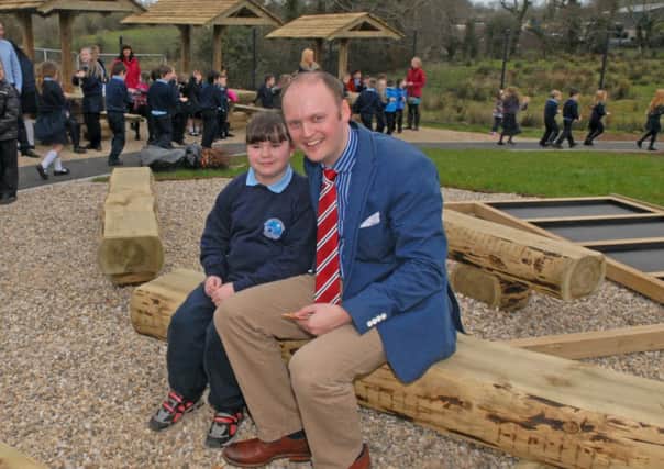 Ballycarrickmaddy Principal Mr Colin Ford along with pupil Heidi Joss who opened the new outdoor provision and sensory garden at the school. INUS1214-BCM5