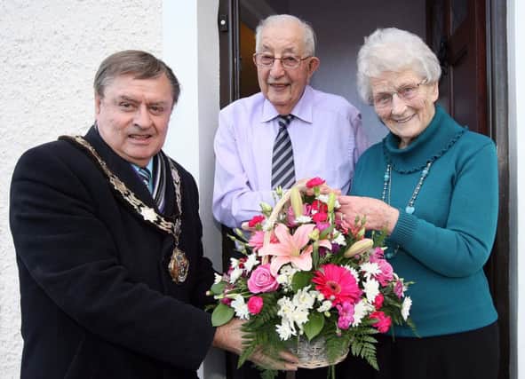 Mayor Fraser Agnew congratulates Johnston (89) and Ethel (83) Barrett on celebrating their 60th wedding anniversary. INNT 10-037-FP