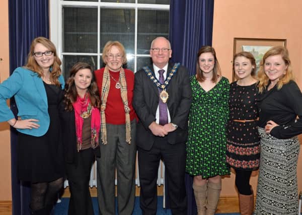Mayor of Carrickfergus Alderman Billy Ashe pictured with student teachers from Anderson, South Carolina. From left: Laura Merk, Ashley Pack, Margaret Hicks (leader), Lindsey Collins, Hannah McKeel and Megan Middleton at the civic reception in the Dobbs Room. INCT 12-008-PSB