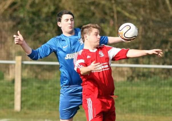 Ballynure Olds Boys' Ronnie Burns controls the ball with his chest in the 1-0 win over Brantwood. Photo: Freddie Parkinson