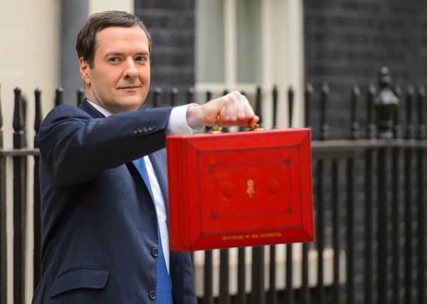 Chancellor of the Exchequer George Osborne outside 11 Downing Street before heading to the House of Commons to deliver his annual Budget statement. PRESS ASSOCIATION Photo. Picture date: Wednesday March 19, 2014. See PA BUDGET stories. Photo credit should read: Dominic Lipinski/PA Wire