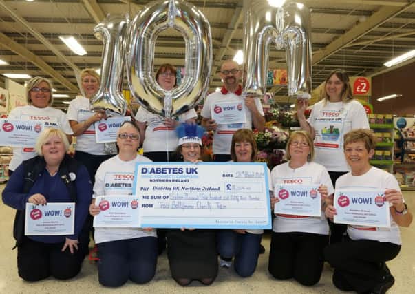 Diabetes UK fundraiser Emma Corry (front centre) receives a cheque for £16,554 from staff at Tesco Ballymena which they raised during a series of fundraising events over the past year. The Ballymena store, who were the second highest fund raisers in the NOrthern Ireland were part of a UK wide campaign which overall raised an incredible £10,000,000. INBT 13-104JC