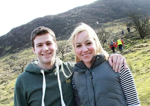 Charlie McNeill and Suzanne McNeill prepared to reach the  top of  Slemish last week on St Patrick's Day.. INBT 13-810H