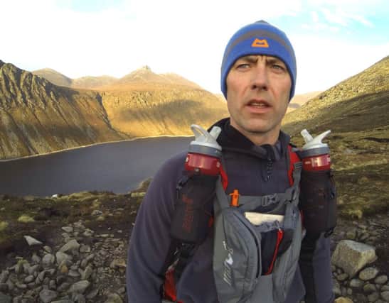 Marathon man: Gary Bloomer takes a breather during a training run in the Mourne Mountains.
