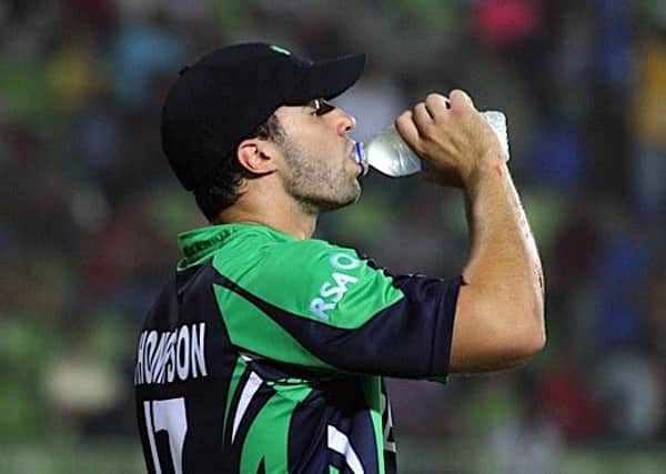 Eglinton and Ireland all-rounder Stuart Thompson takes a drink, during today's game against Holland.
