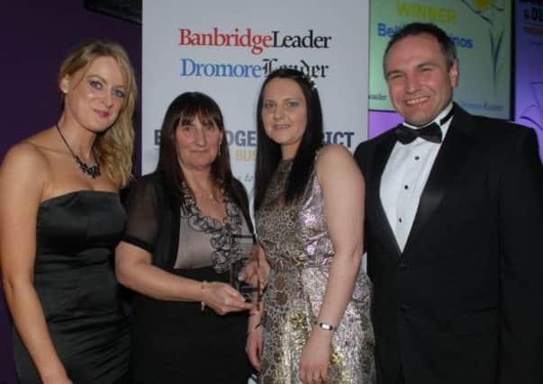 The Best Customer Service Awards at the Banbridge District Business Awards went to Audrey and Melissa Edens from Bella Bambinos. Presenting the award was Pauline Tipping and Chris Nelmes from category sponsor The Outlet.  INBL1214-BUSAWARDS40