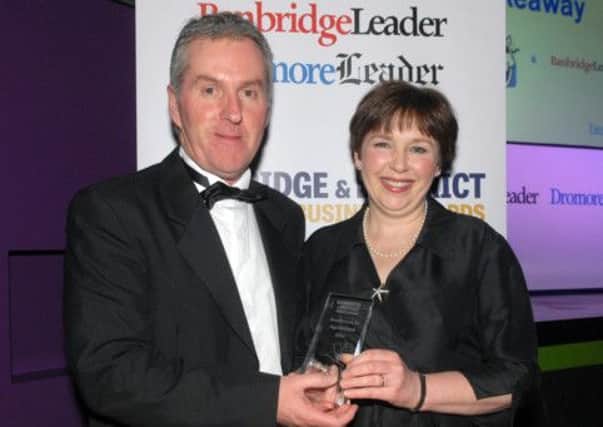 Victor Kelly representing The Leader, presents the Excellence in Agriculture award to Lesley Bell from Moorfield Flowers at the Banbridge District Business Awards.  INBL1214-BUSAWARDS35