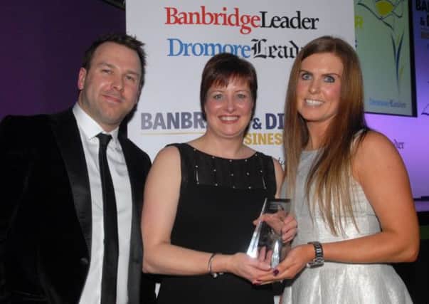 Michael and Sarah Callen present the Best Retailer award at the Banbridge District Business Awards to Roisin McAleenan from Angelic Bridal. INBL1214-BUSAWARD43