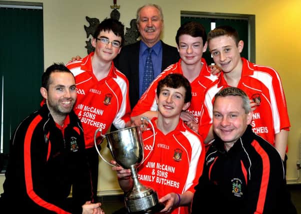 Team members of St Paul's Gaelic Football Team celebrate with staff following the teams victory in the McDevitt Cup final for the second year in a row. Included in the photo are from left, Mr Martin McMahon, coach, Ruairi McConville, goal scorer, Mr Sean Flanagan, school principal, Jack Lenehan, team captain, Jamie Haughey, vice captain, Shea Geraghty, scored 3 points, and Mr Mickey Donnelly, coach. INLM13-214.