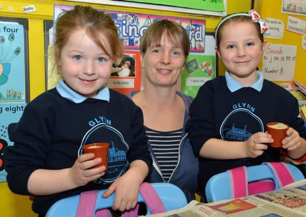 Mrs Ingram is pictured with Abbi and Holly and their seeds at Glynn Primary School. INLT 13-017-PSB