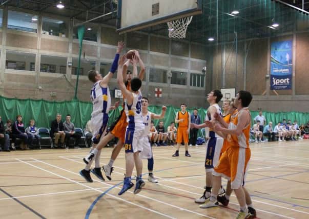 Action from the Magherafelt Titans- Tyrone Towers Under 18 basketball decider at the Antrim Forum