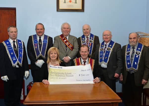 Bobby Duffin Worshipful Master of LOL No 22 presents a cheque for £200 on behalf of members of LOL No 22,LOL No 70 and LOL No 692 to Mrs Avril Napier of Roddensvale School, also pictured are (from left) David Montgomery and Leslie Duffin from LOL No 692, Ted Geary from LOL No 22 and Fred Andrews, Ted Drummond and Victor Haslett from LOL No 70. The money was raised through a collection at an "Orange Open Night" in the Victoria Orange Hall. INLT 13-078-PSB
