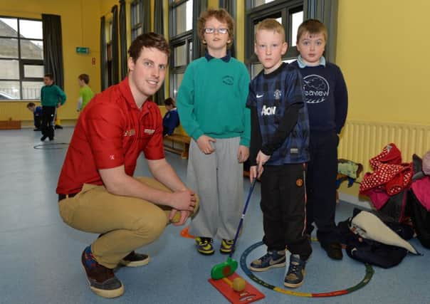 Enda Campbell from the Darren Clarke Foundation is pictured with Adam, Tommy and Owen at the cross community event with pupils from Carnalbanagh Primary School, Carnlough Integrated Primary School and hosted by Seaview Primary School, Glenarm. INLT 13-021-PSB