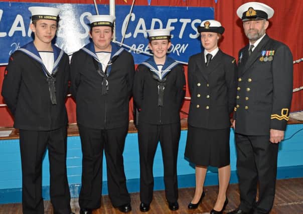 Senior members of Larne Sea Cadets (from left) Adam Maguire, Jay Bergin, Catherine Rowan and Petty Officer Nicola Todd are pictured with Lieutenant Alan Tweed at their annual Unit Inspection in Dixon Hall. INLT 13-035-PSB