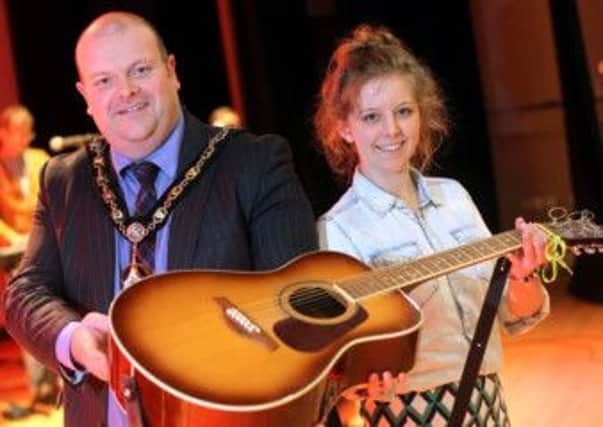 Mayor of Craigavon Councillor Mark Baxter with singer and songwriter Caitlin Cousins who performed at the event