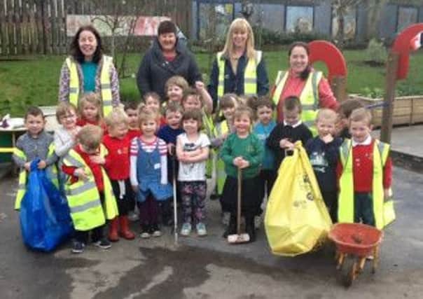 Staff and children at Kylemore Nursery School taking part in the TIDY Northern Irelands BIG Spring Clean initiative. INCR13-207S
