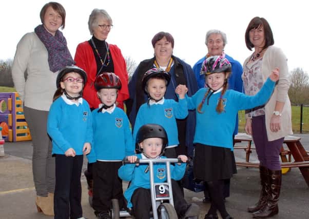 Mary Waldron, President of Ballymena Inner Wheel, along with members Kerry McKerville and Lillian Smyth present the children of Castle Tower with a trike to mark the Inner Wheels 90th anniversary. Included are Mrs. O. Fyffe (teacher) and Mrs. N. Donnelly (classroom assistant).