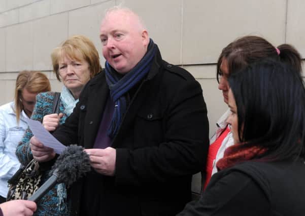 Fr Joseph Quinn, right, brother of Declan, and Veronica, left, mother of Declan, outside Laganside Court in Belfast.