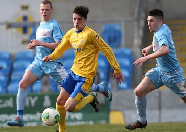 Ballymena United's Leroy Millar and Michael Ruddy prusue Dungannon's
Jamie Glackin during Saturday's match at the SHowgrounds. Picture: Press Eye.