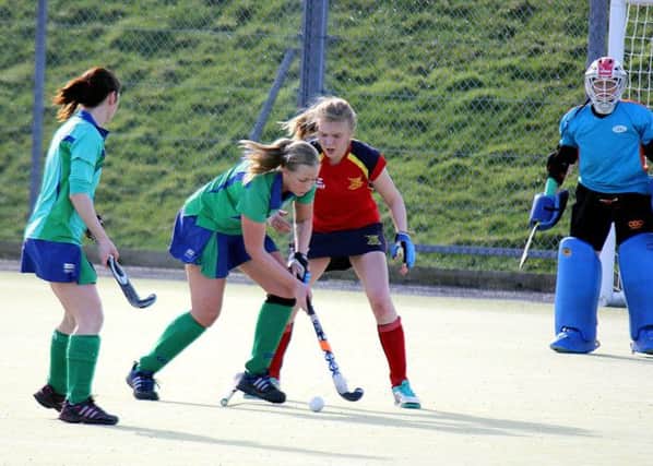 Ballyclare Ladies, in action during a recent clash with Ballymena, still await their Senior 1 fate.