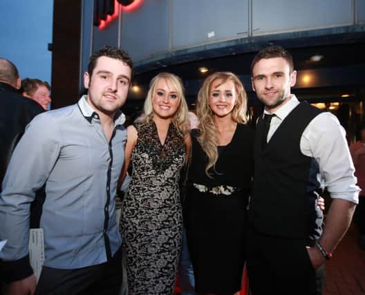 The second generation of the legendary road racing Dunlop family Michael, (left) and William (right)_ pictured with their girlfriends Holly Gahan (left) and Janine Brolly at the gala premier of Road, which opens the 14th Belfast Film Festival at the Movie House , Dublin, road, Belfast.  Picture by Brian Morrison.